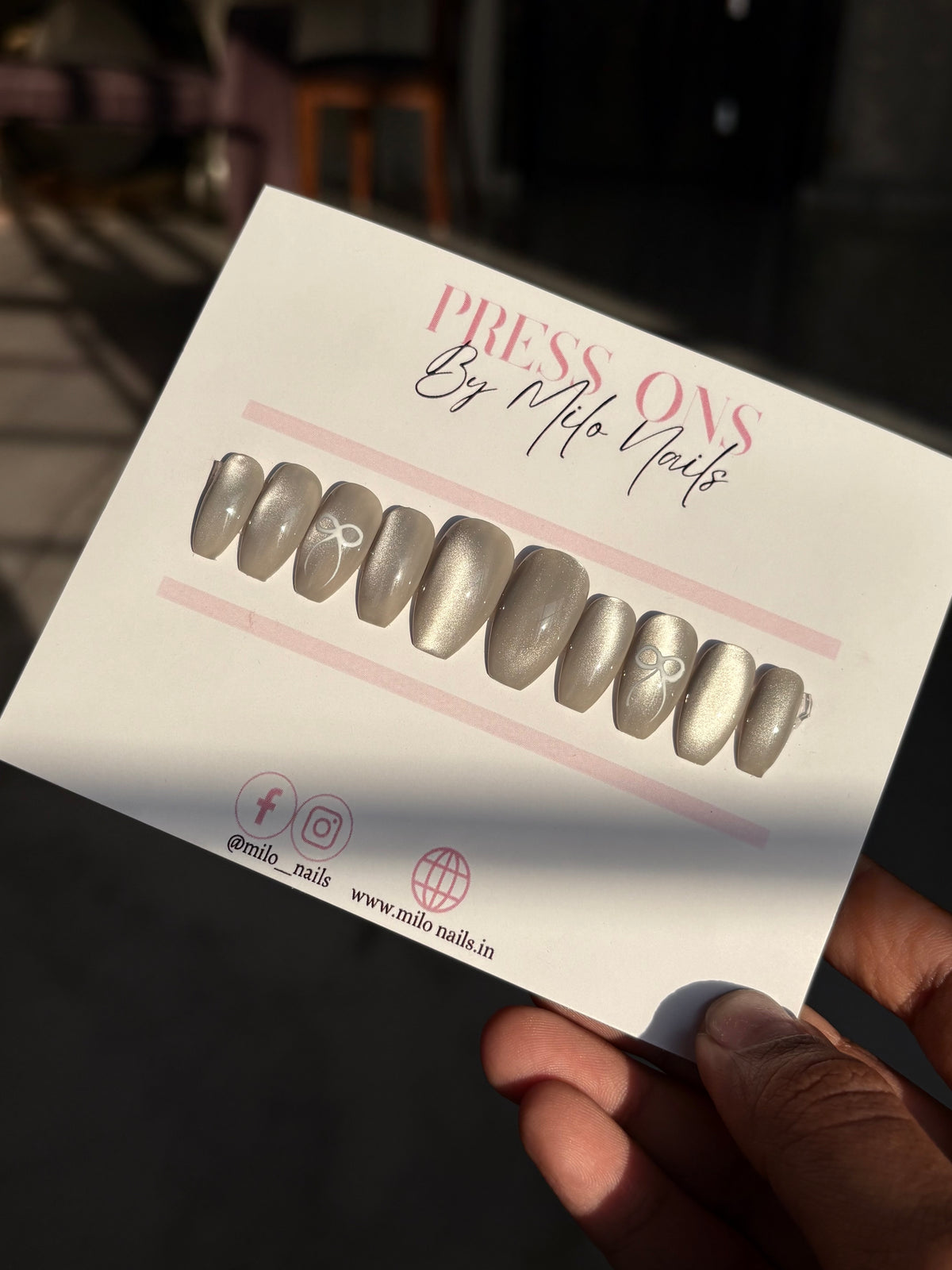 Grey cateye with bow