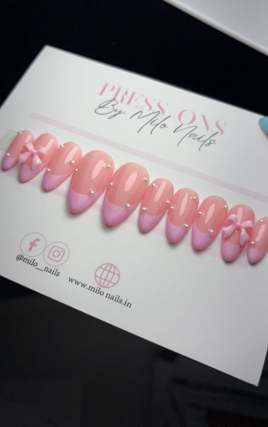 Pink tips with bows and pearl