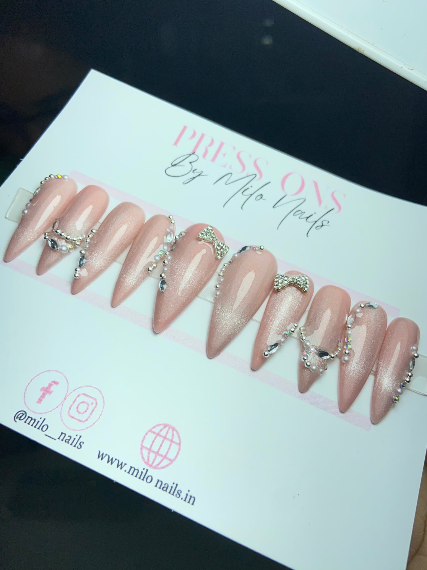 Pink cat eye nails with bow