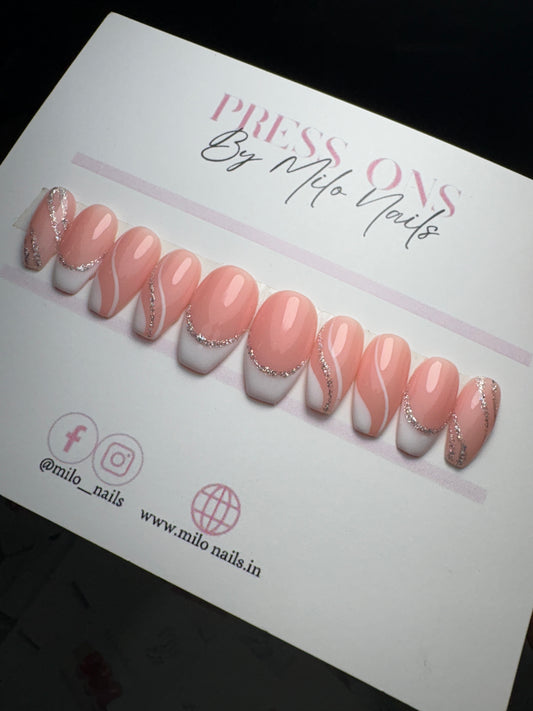 White swirls and glitter nails