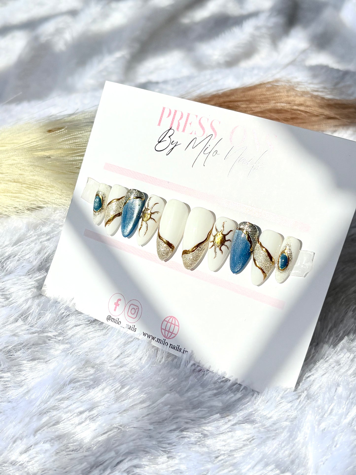 White - blue cat eye nails
