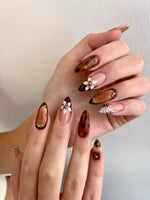 Brown flower with printed nails
