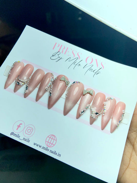 Pink cat eye nails with bow