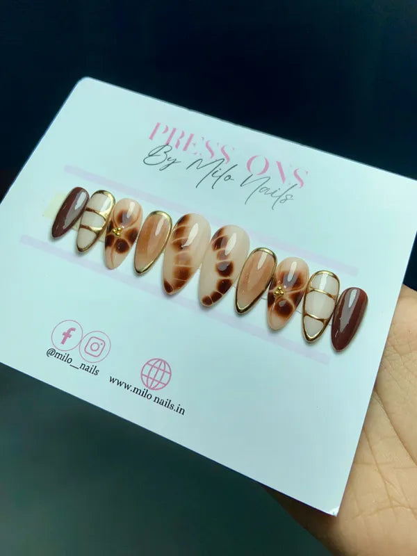 Brown greek metallic nails