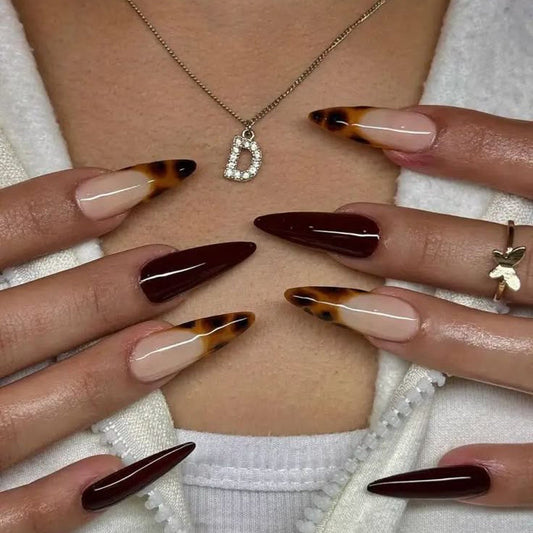 Maroon nails with cheetah print