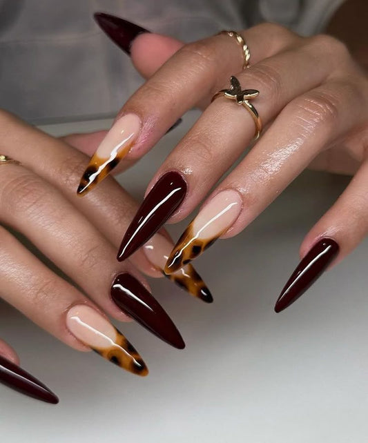 Maroon nails with cheetah print