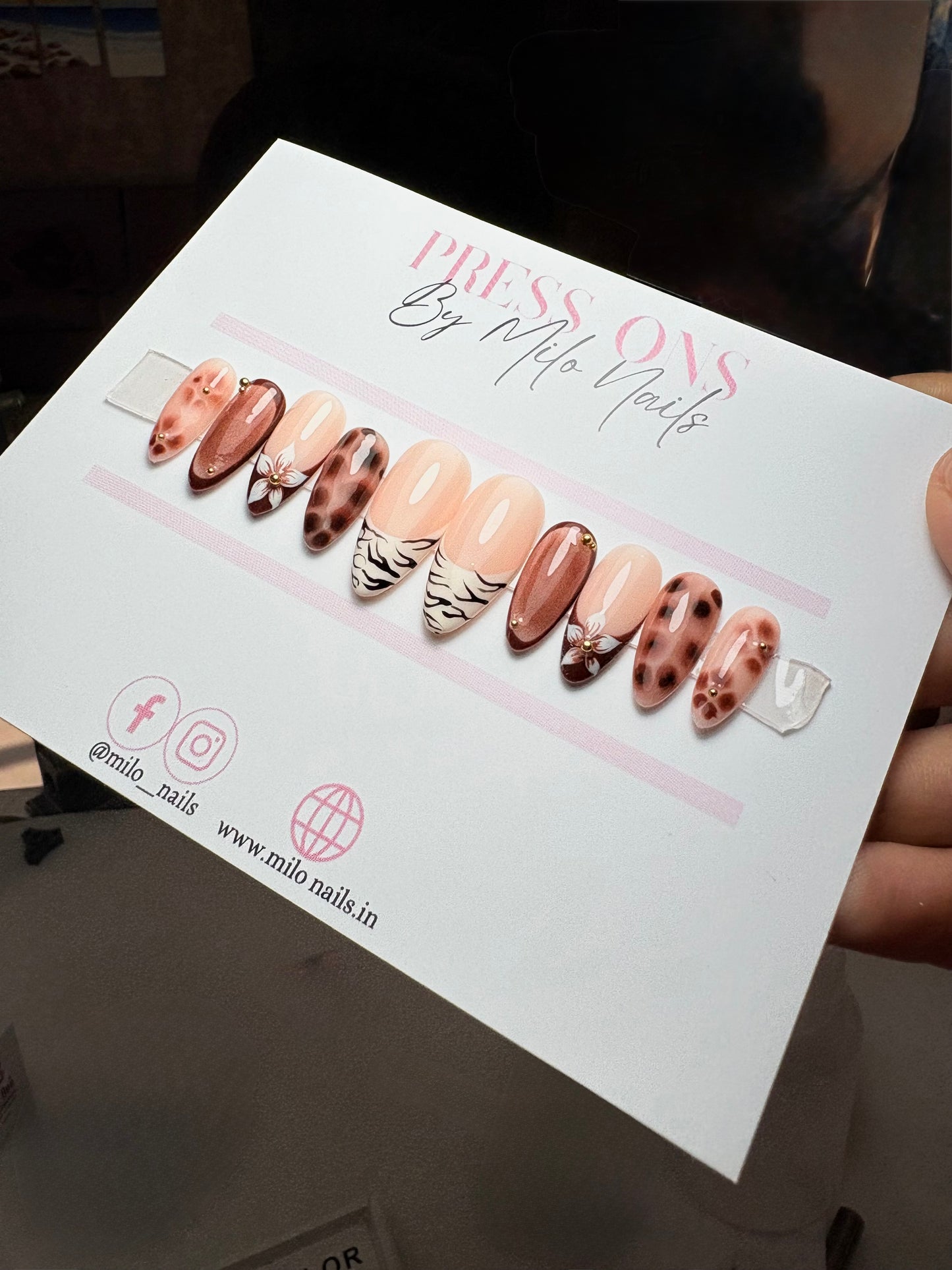 Brown flower with printed nails