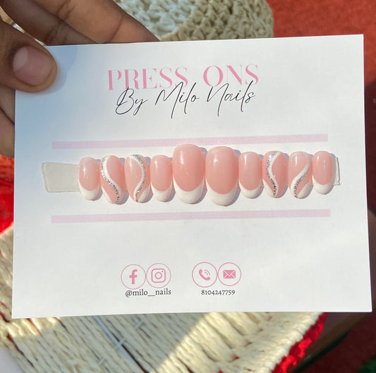 White swirls with glitter nails