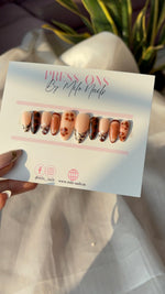 Brown flower with printed nails