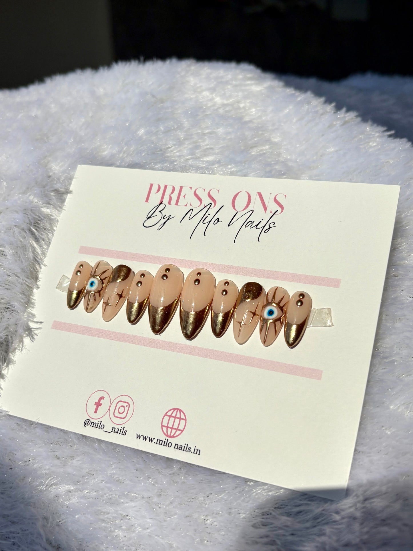 Golden metallic evil eye