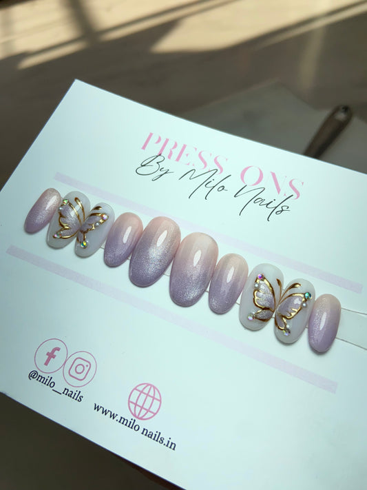 Purple butterfly chrome nails