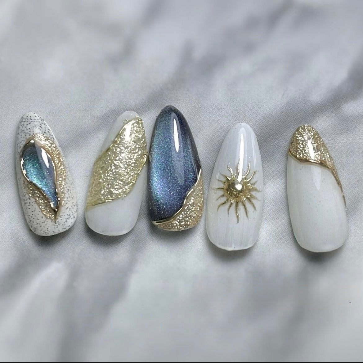 White - blue cat eye nails