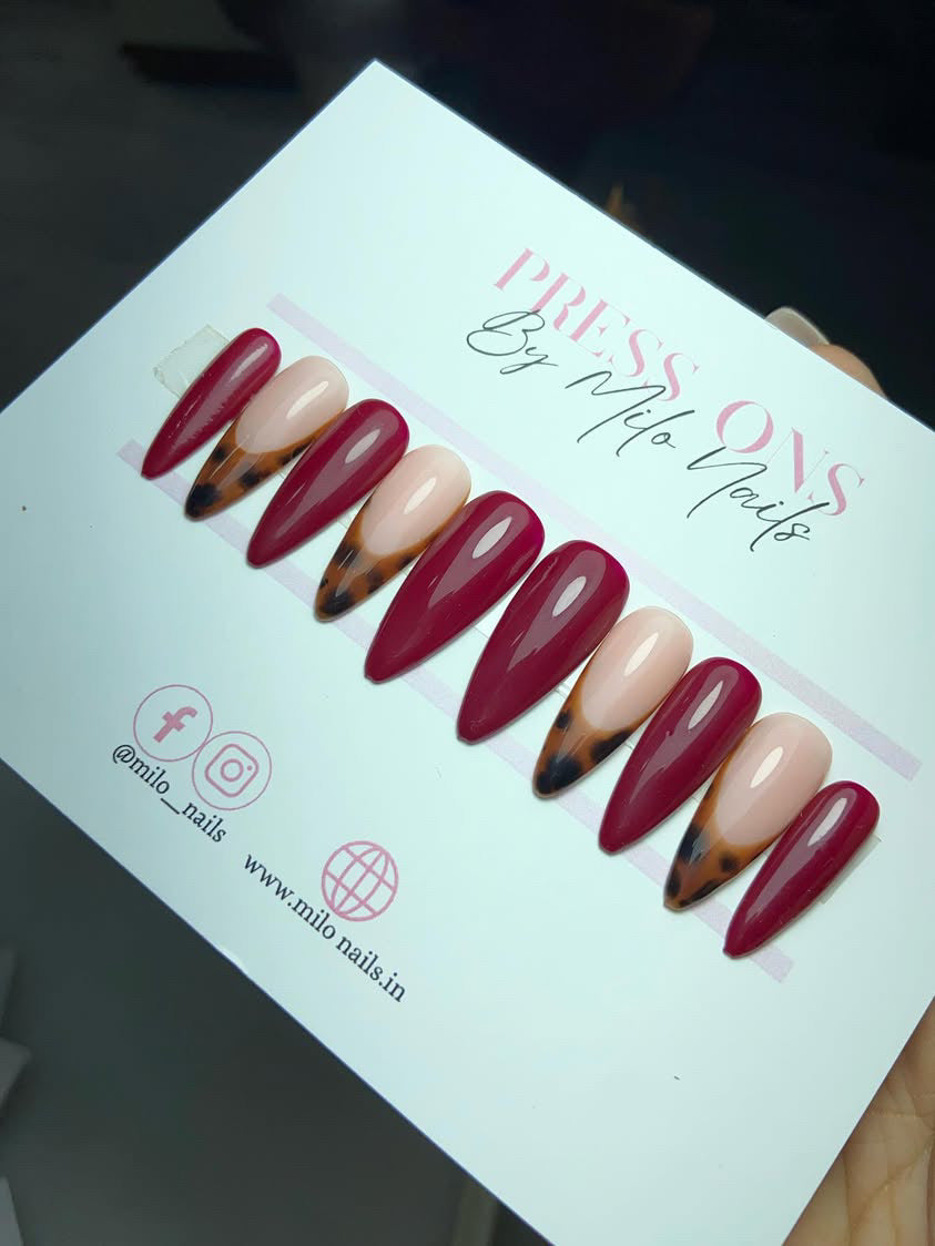 Maroon nails with cheetah print