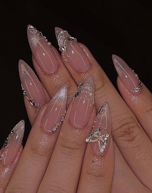 Pink cat eye nails with bow