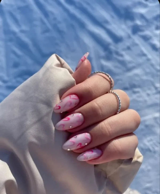 Pink hearts and rhinestones nails