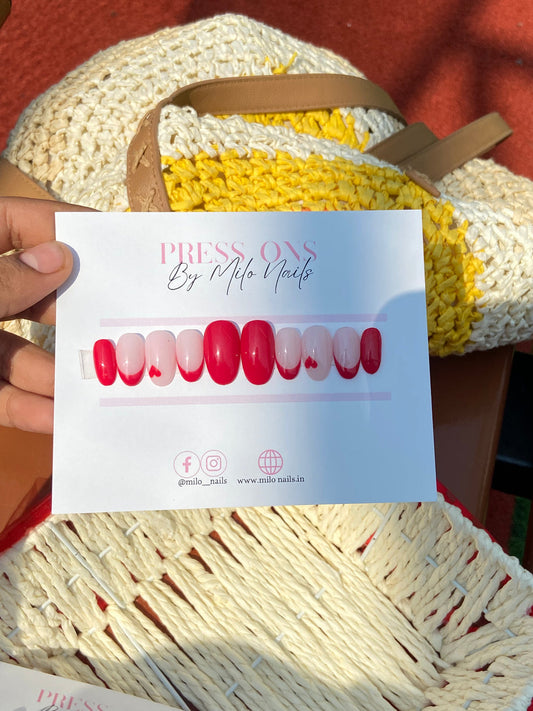 Red tips with heart nails